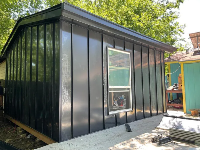 Black standing seam metal wall panels for Roof Inspection in Highland